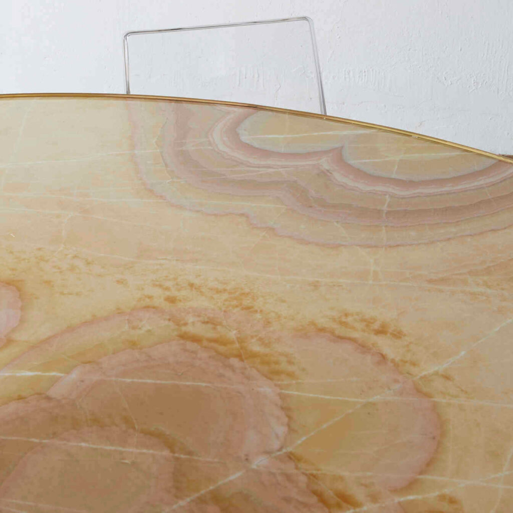 Top-down perspective of the table, emphasizing the stunning patterns in the onyx and its glossy finish.